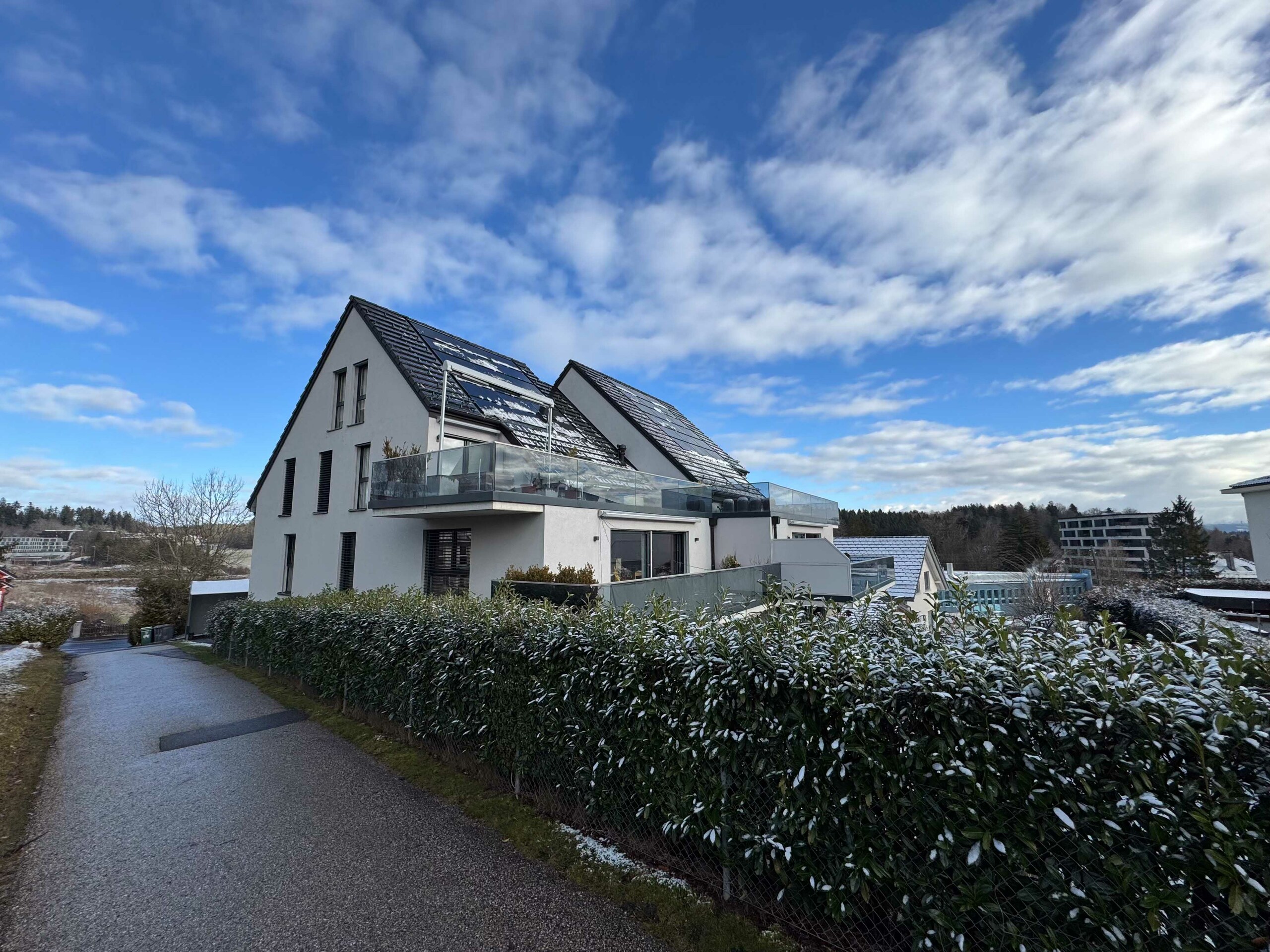 a modern home with a sloped roof